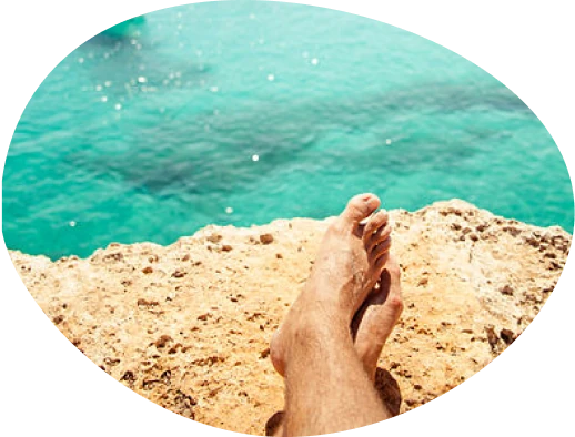 Person on rock on beach